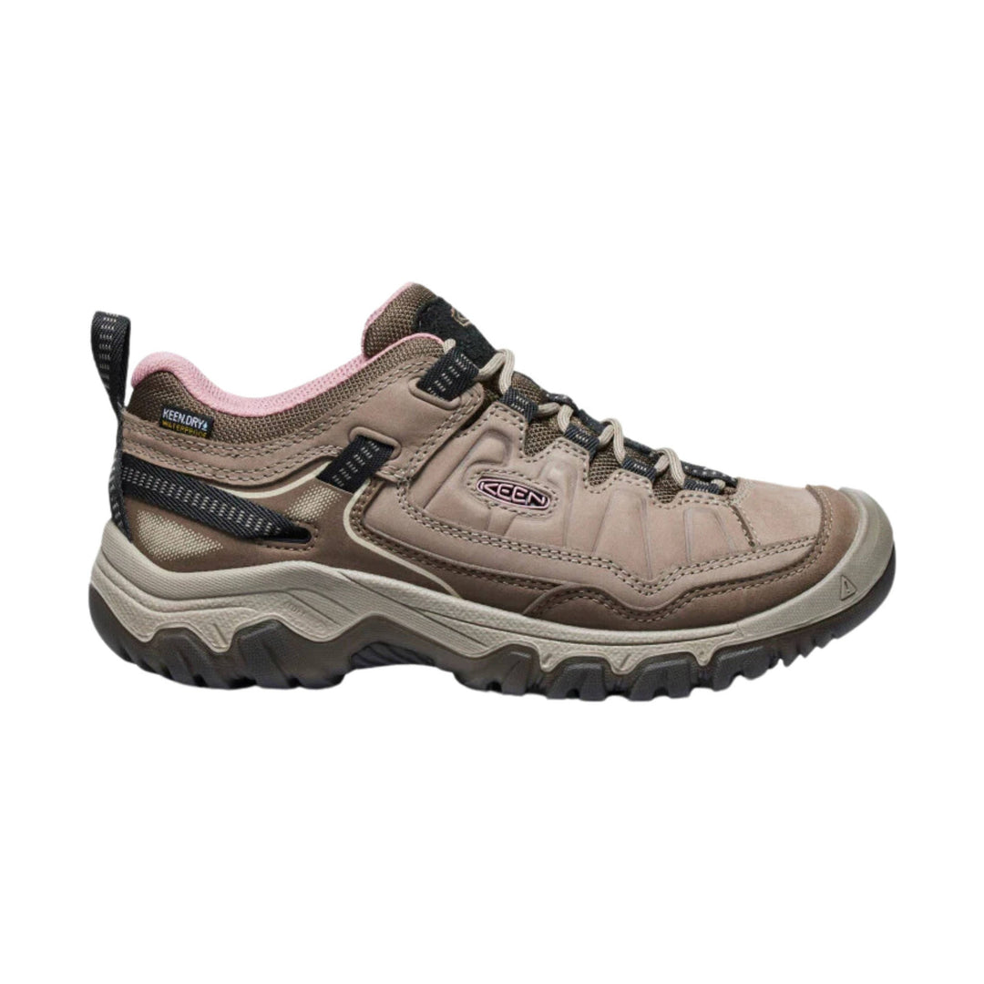 Brown and pink low hiking shoe with black laces and a rugged treaded sole