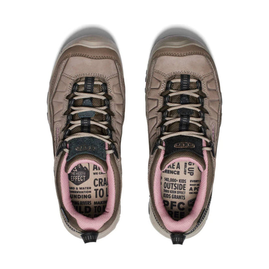 Pair of tan and brown hiking shoes with pink collars, top view, showing bungee laces and printed insoles