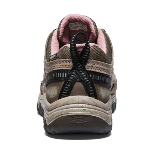 Rear view of a brown and pink hiking shoe with black bungee laces