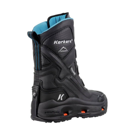 Black winter boot with blue lining, rugged tread, and orange sole accents