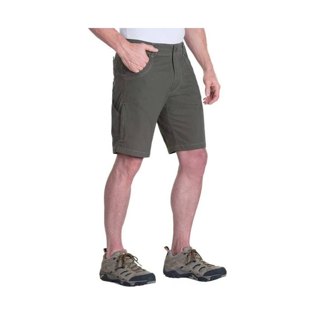 Olive cargo shorts with front pockets, worn with hiking shoes