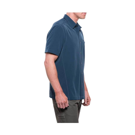 Short-sleeve button-up shirt in dark blue, shown in side profile