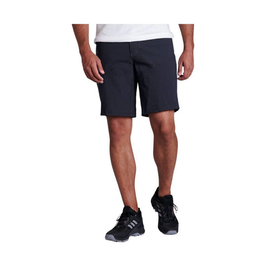 Black athletic shorts worn with a white T-shirt and black running shoes