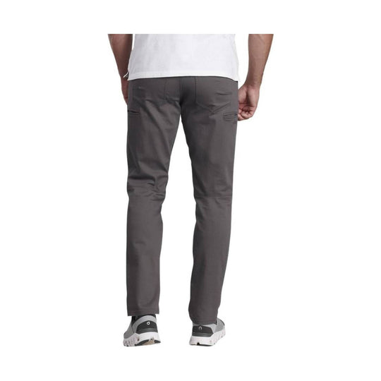 Dark gray slim-fit pants shown from the back with rear pockets and tapered legs