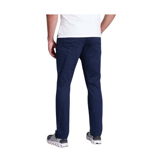 Rear view of navy tapered jeans with five-pocket styling