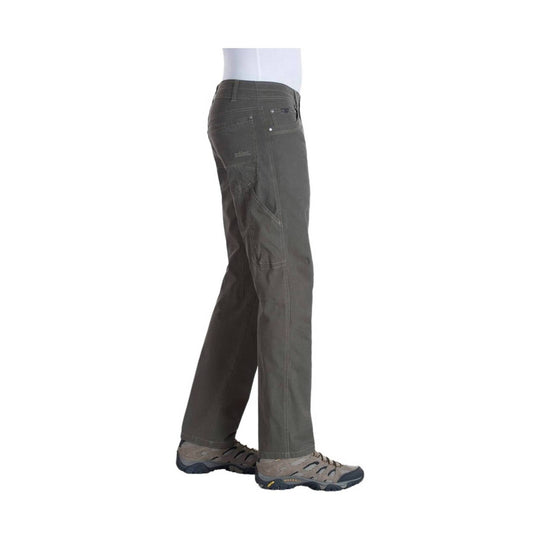 Dark gray hiking pants shown in side view on a mannequin with cargo pockets and visible Columbia logo