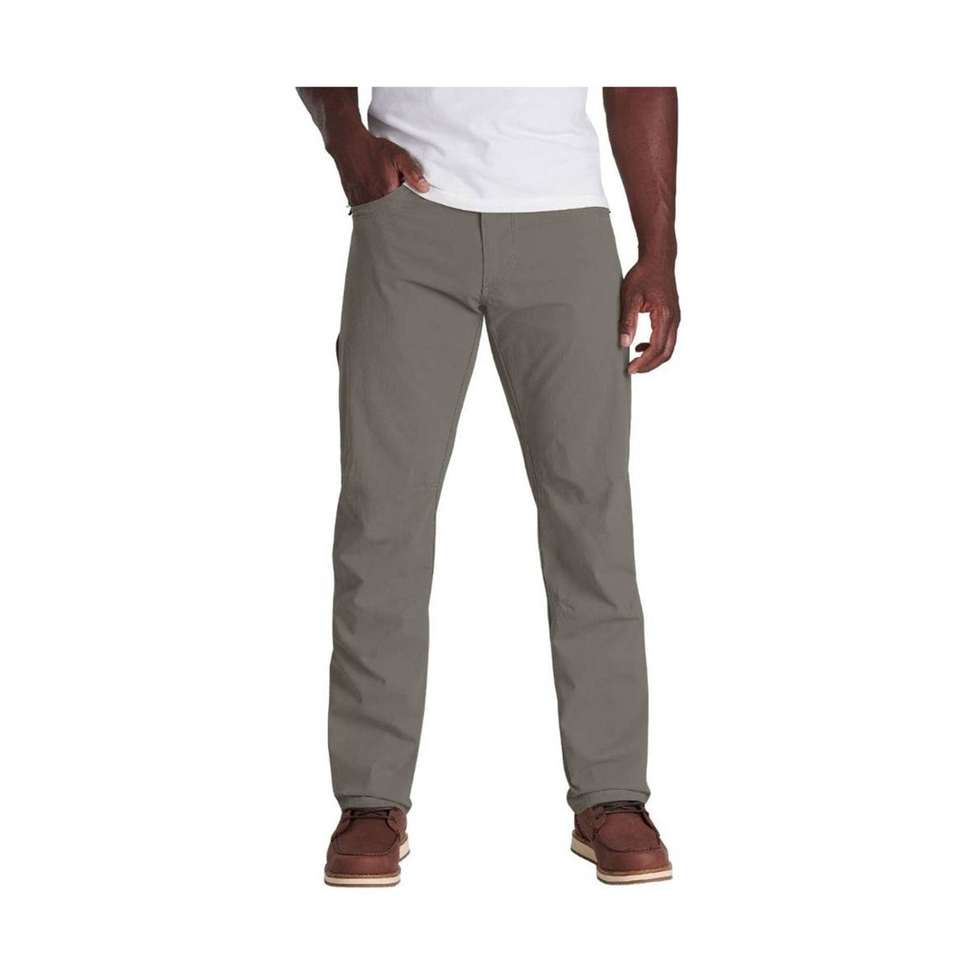 Gray slim-fit stretch pants on a model, shown full length with straight legs and front pockets