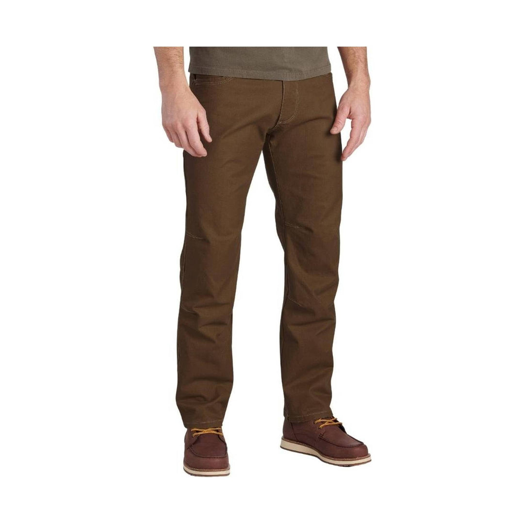 Brown straight-leg pants with front pockets and brown casual shoes
