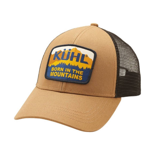 Tan trucker hat with black mesh back and a KÜHL patch that says "BORN IN THE MOUNTAINS"