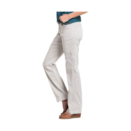 Light beige wide-leg pants shown in side view with front pocket and tan wedge sandals