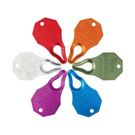 Six colorful metal tick removers with teardrop handles arranged in a circle