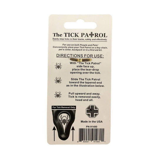 Tick removal tool in beige retail packaging with usage instructions and a black tick illustration