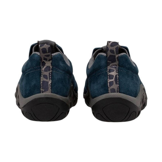 Pair of dark blue slip-on kids' shoes shown from the back with black soles and patterned heel tabs