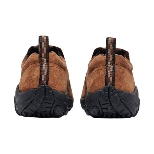 Brown suede slip-on shoes shown from the back with black treaded soles and striped pull tabs