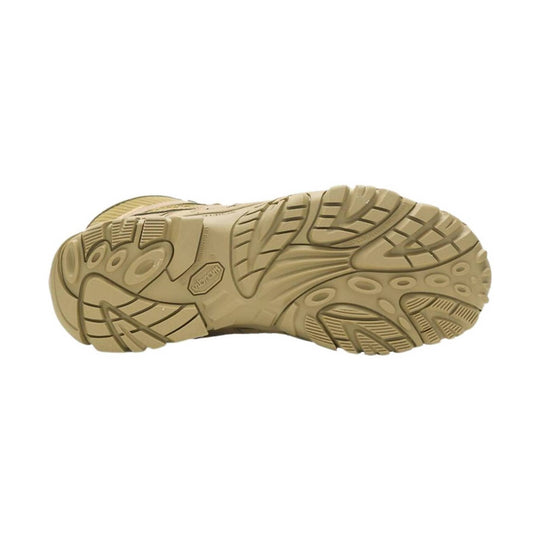 Tan boot outsole with deep lug tread, viewed from below