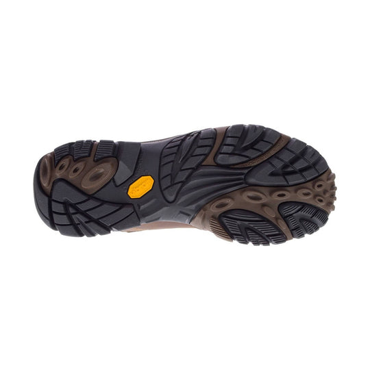 Black and brown hiking boot outsole with deep lug tread and yellow Merrell logo