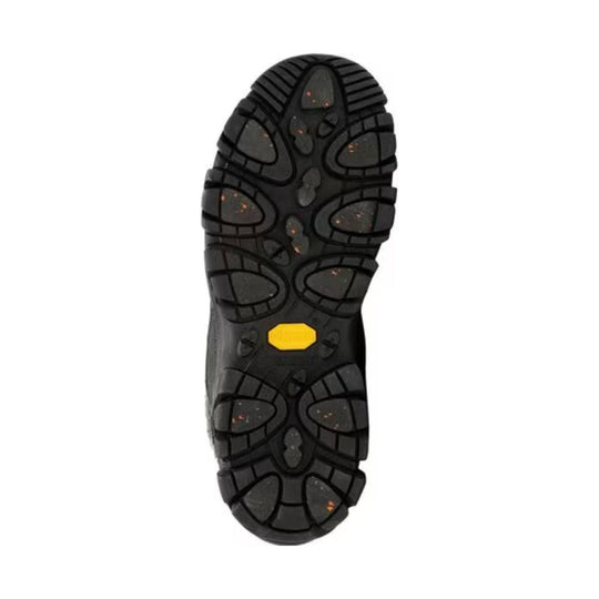 Black rugged boot outsole with deep tread and a yellow midfoot insert