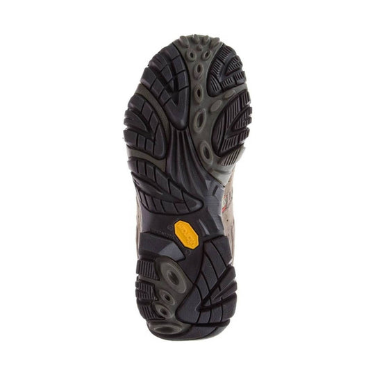 Black and gray hiking boot outsole with deep tread and a yellow Vibram badge