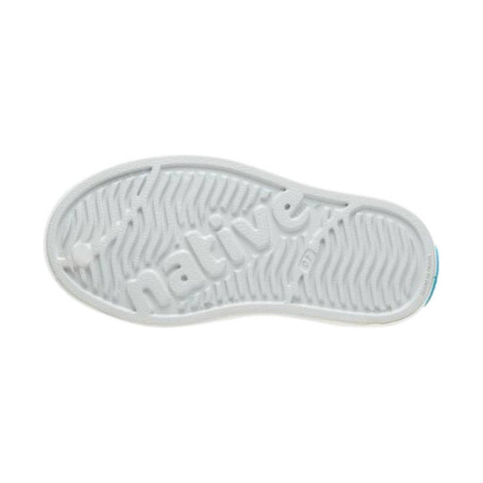White rubber shoe outsole with wavy tread and embossed Native logo