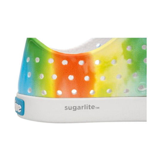 Rainbow tie-dye clog with perforated upper and white sole, side view