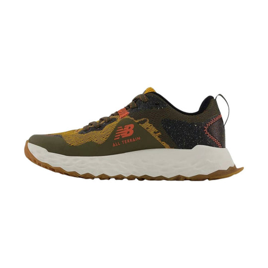 Brown and black trail running shoe with white foam sole and NB All Terrain branding