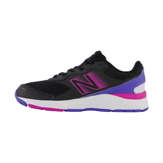 Black athletic sneaker with magenta and purple accents, white midsole, and large side logo