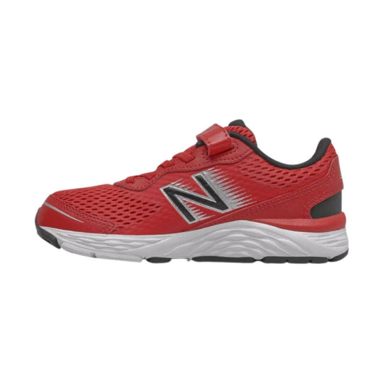 Red athletic sneaker with black trim, white midsole, and hook-and-loop strap