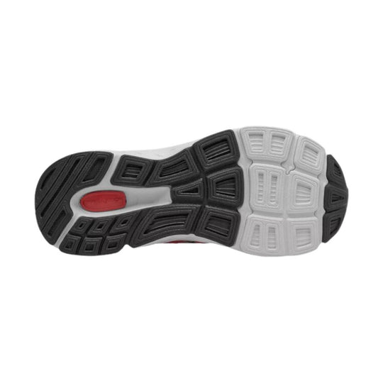 Black and white athletic shoe outsole with a red oval insert