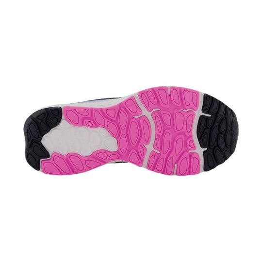 Pink, white, and black sneaker outsole with rounded tread pattern