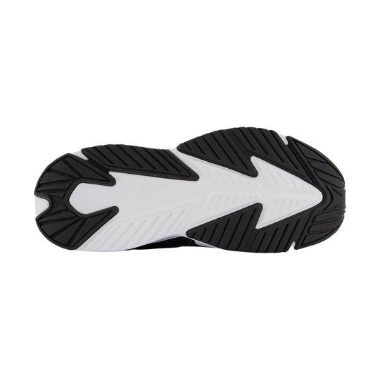Black-and-white sneaker outsole with deep tread and a large arrow-shaped white midfoot section