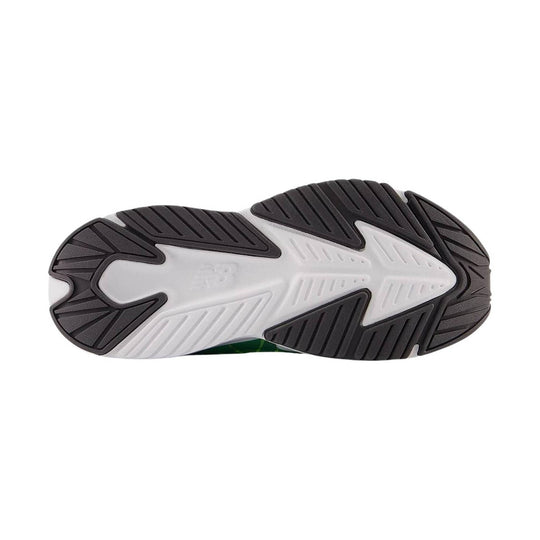 Black and white sneaker outsole with chunky tread and a molded midfoot logo