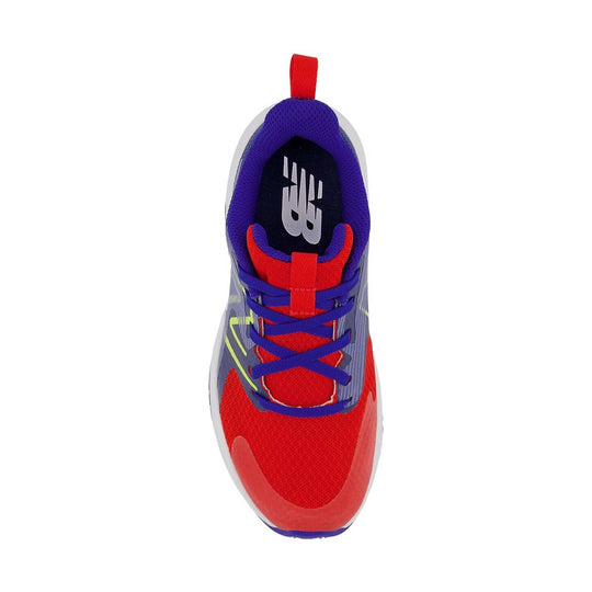 Colorful kids' running sneaker seen from above with purple collar, red toe, blue laces, and NB logo on the insole.