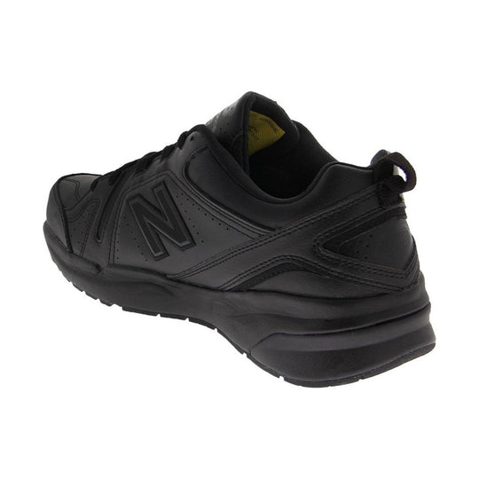 Black athletic training shoe in side view with perforated panels and thick cushioned sole