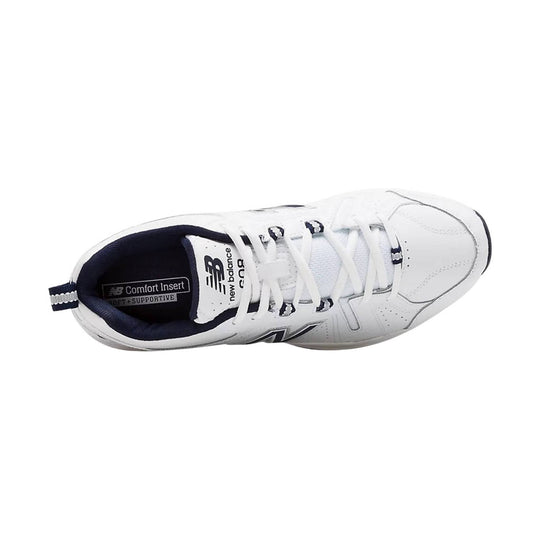 White low-top athletic shoe with navy collar, white laces, and visible side branding