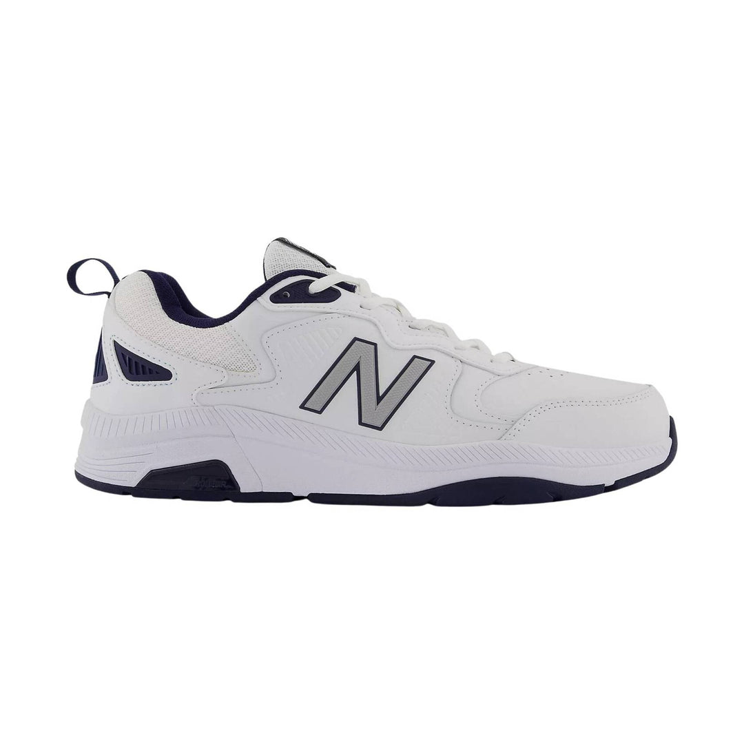 White athletic sneaker with navy accents and a large side logo, shown in profile