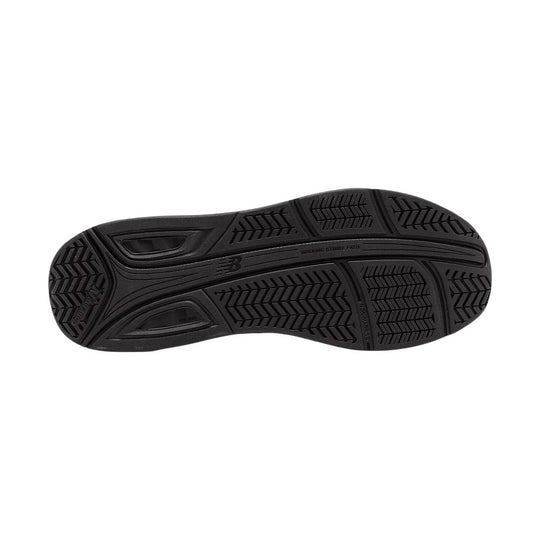 Black walking shoe outsole with tread patterns and molded support zones