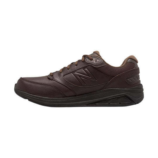 Brown leather walking shoe with lace-up closure and black sole, side view