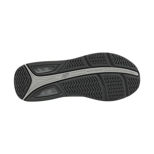 Black walking shoe outsole with segmented tread, gray center stripe, and visible "WALKING STRIKE PATH" text