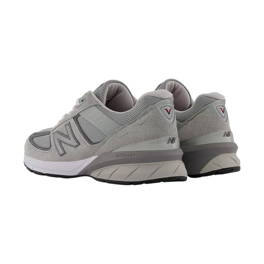 Gray mesh and suede running sneakers shown from the side and rear