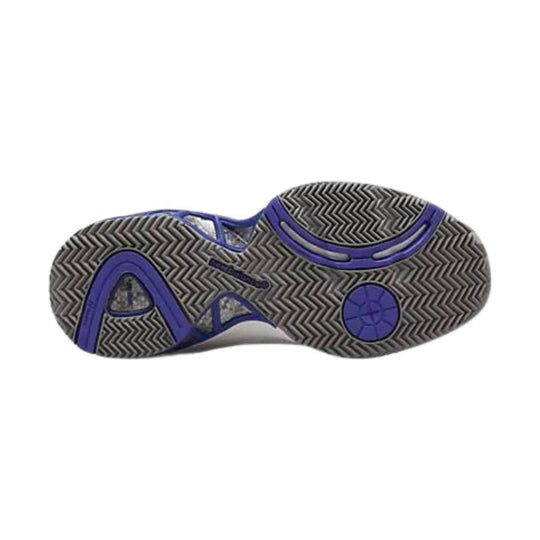Outsole of a white athletic shoe with black herringbone tread and purple rubber inserts