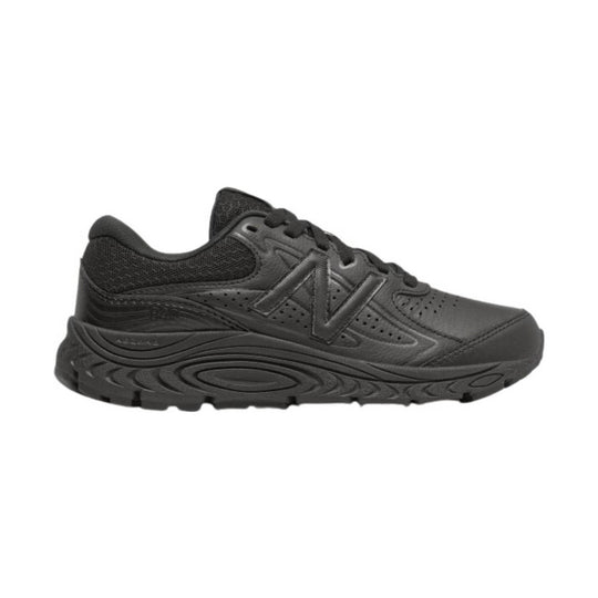 Black low-top athletic sneaker with mesh panels, lace-up closure, and thick sculpted sole
