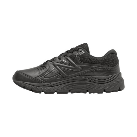Black athletic sneaker in side view with mesh upper and thick treaded sole