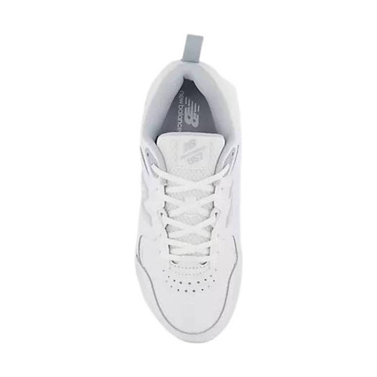 White athletic sneaker seen from above with laces, perforated toe box, and gray tongue lining