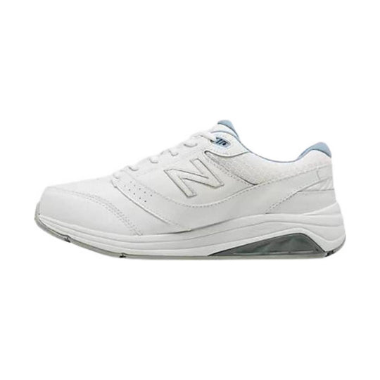 White walking sneaker with a thick cushioned sole, side N logo, and light blue collar accents