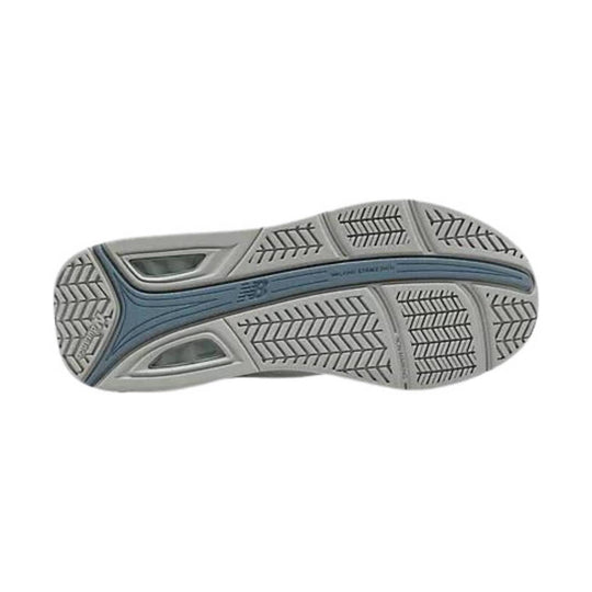 Gray and blue sneaker outsole with chevron tread pattern