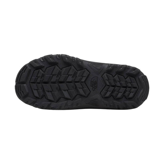 Black winter boot sole with deep tread and The North Face logo