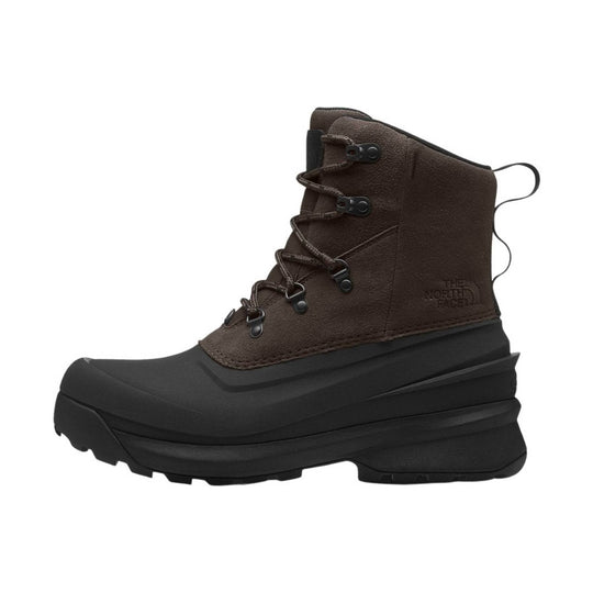 Brown lace-up winter boot with a black rubber shell sole and embossed logo on the side