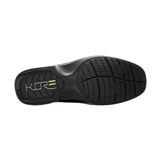 Black shoe outsole with textured tread and KORE logo