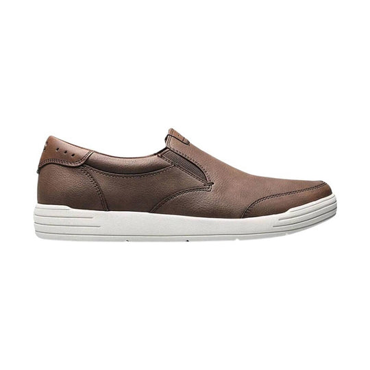 Brown leather slip-on shoe with a white platform sole, side elastic gore, and moc-toe stitching
