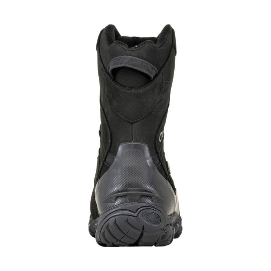Black insulated winter boot shown from the back with a thick treaded sole.